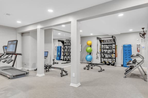 the gym at the landing at pullman apartments in pullman  at Brampton Moors, Cary, NC, 27513