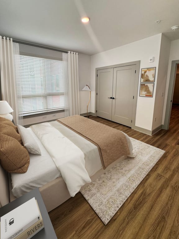 a bedroom with a bed and a window  at South and Hollis, North Carolina