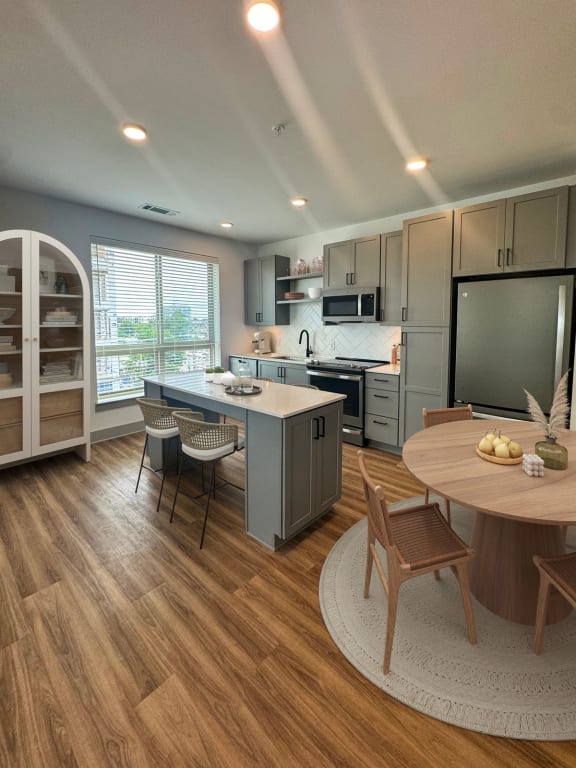 a kitchen and dining room with a table and chairs  at South and Hollis, North Carolina