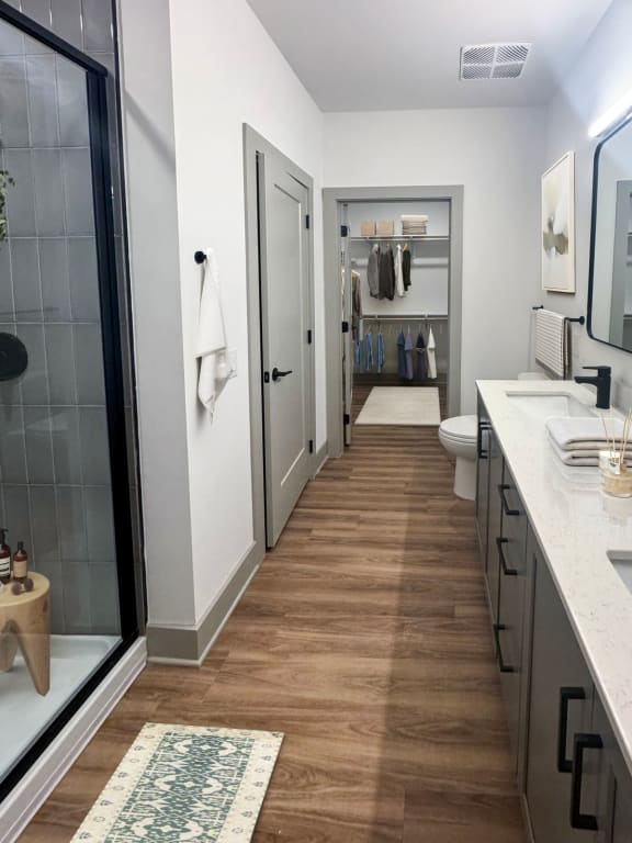 a bathroom with a shower and a sink and a toilet  at South and Hollis, Charlotte