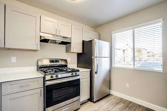 A kitchen with a stove, oven, and refrigerator. at Sterling Point Apartment Homes, Arizona, 85042