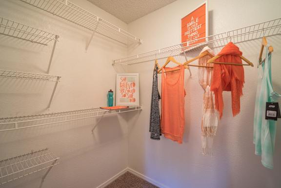 A white wall with clothes hanging on it at Sterling Point Apartment Homes, Phoenix