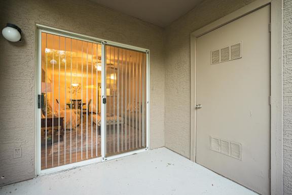 A room with a sliding door and a white door at Sterling Point Apartment Homes, Phoenix, 85042
