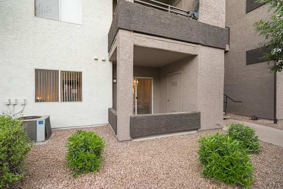 A modern house with a white exterior and a grey extension at Sterling Point Apartment Homes, Phoenix, AZ