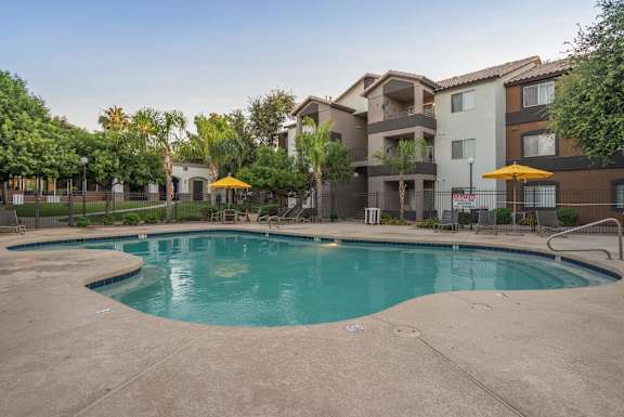 A swimming pool in front of apartment buildings at Sterling Point Apartment Homes, Phoenix, 85042