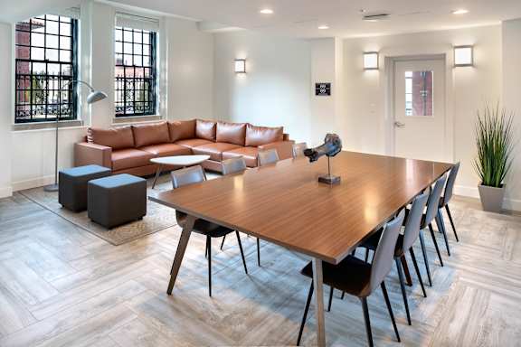 A modern living room with a wooden table and chairs.at The Residences at St. Elizabeths East, Washington