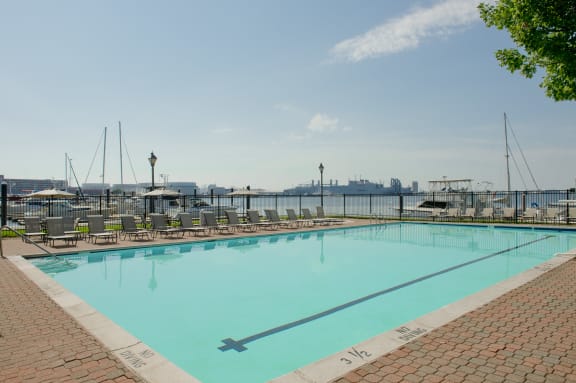 a swimming pool with a view of the harbor and the city at Tindeco Wharf, Baltimore, MD 21224