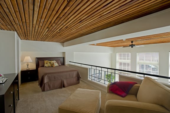 a bedroom with a bed and a balcony at Tindeco Wharf, Baltimore