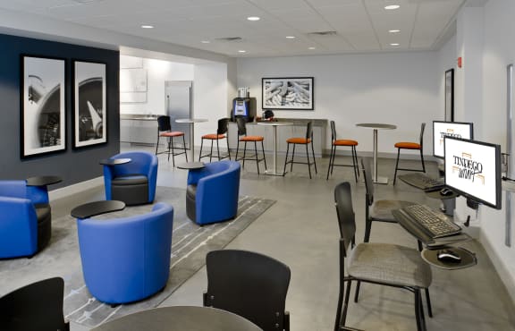 a room with tables and chairs and a computer in a room at Tindeco Wharf, Baltimore Maryland
