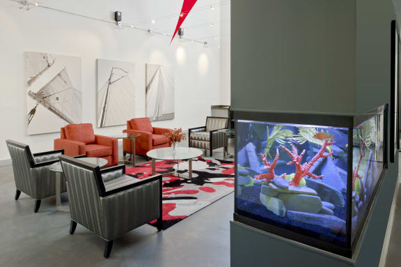 a large aquarium in a room with chairs and tables at Tindeco Wharf, Baltimore, 21224