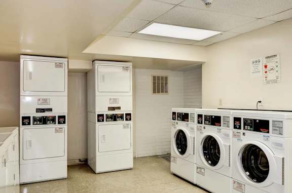 A row of washing machines in a laundromat.