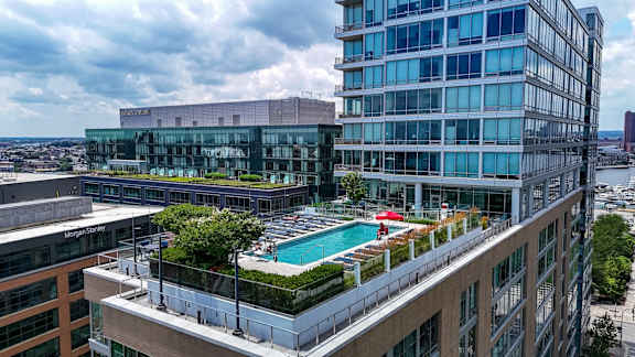 Rooftop pool deck with city skyline views at 1405 Point Apartments, Baltimore