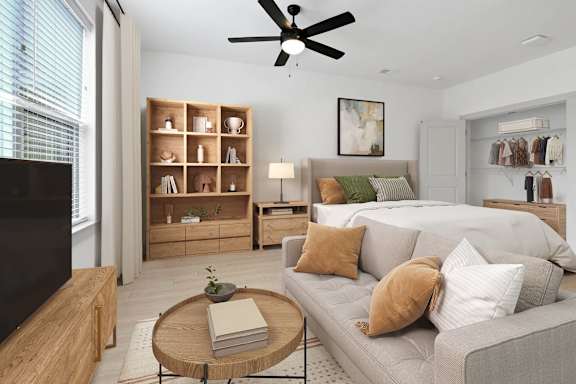 a living room with a couch and a bed at Metropolitan at the Riverwalk, Wilmington, NC