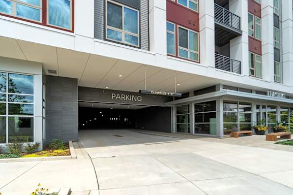 A parking entrance is located under a covered walkway.