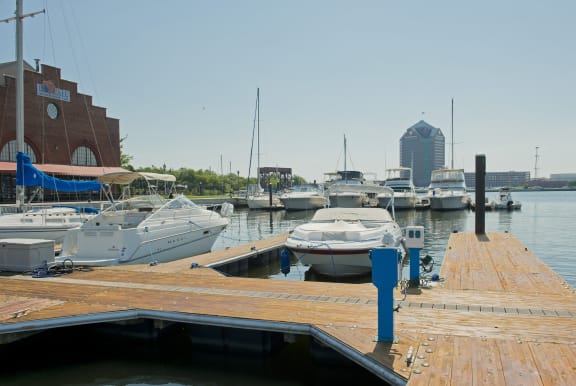 many boats are docked at a dock in a marina at Tindeco Wharf, Maryland, 21224
