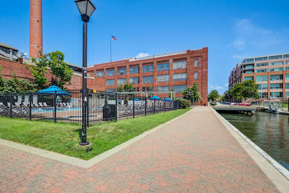 A brick walkway leads to a building Tindeco, Wharf, Baltimore, MD 21224