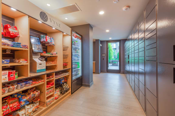 a store with a long hallway filled with shelves and a door at Vyne One Loudoun Apartments in Ashburn, VA