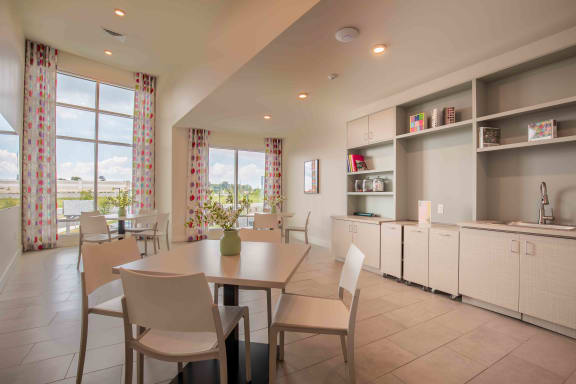 a dining room with a table and chairs