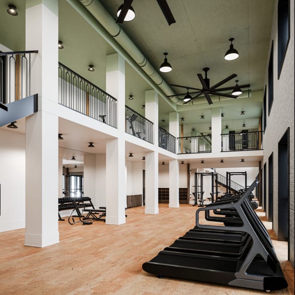 a gym with treadmills and exercise equipment in a large room at La Unión, Tampa, FL 33605