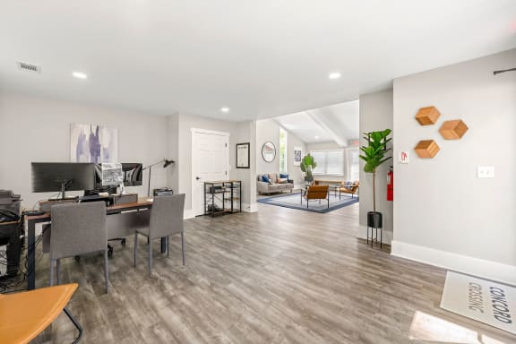 renovated leasing center with a table and chairs at Concord Crossing in GA 30082