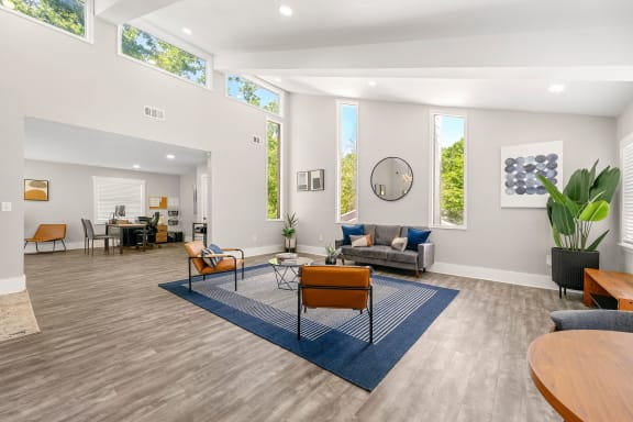 leasing center with couches and chairs and a rug at Concord Crossing in Smyrna, 30082