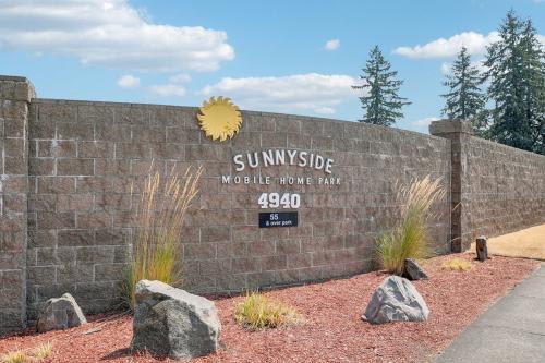 The image shows a wall with the text "SUNNYSIDE Mobile Home Park" and the number "4940" on it.