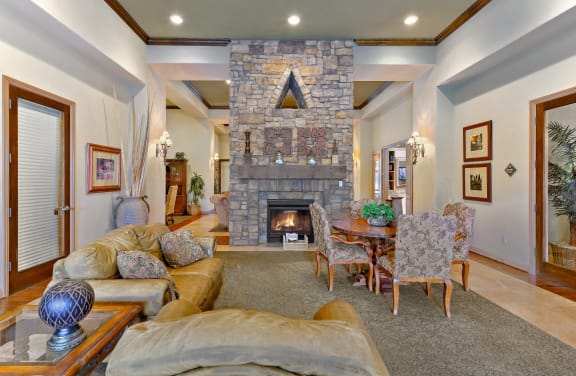 Electric Fireplace and a dining room with couch and tables and chairs