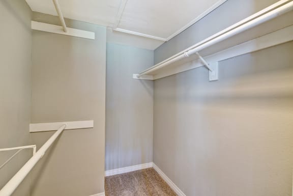 Spacious closet with white shelves