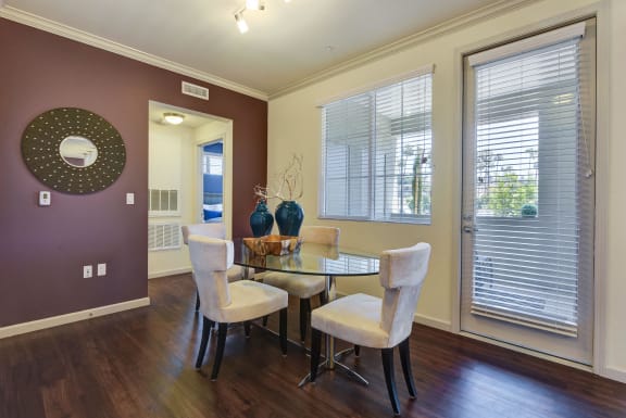 Vinyl Plank Flooring in a dining room with a table and chairs and a window at SETA, La Mesa