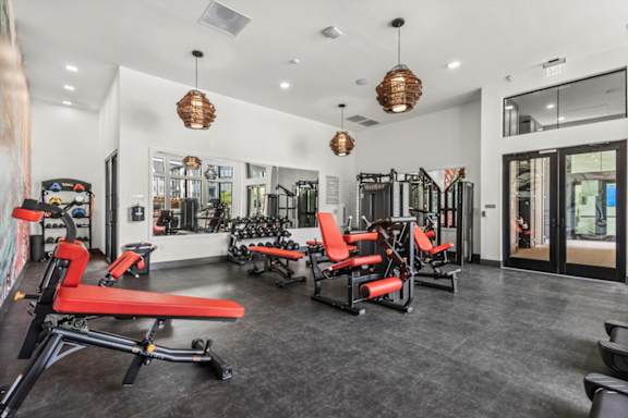 A gym with red and black equipment.
