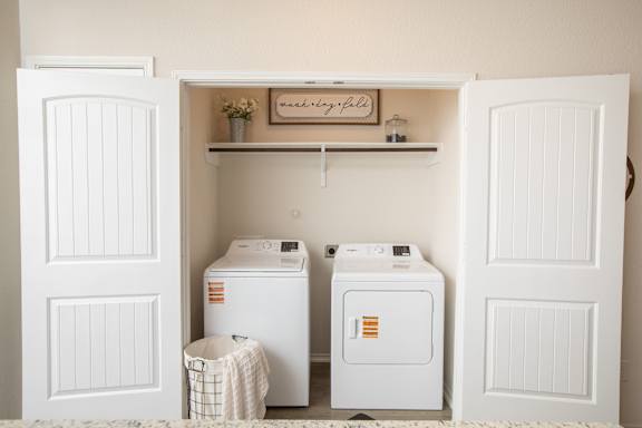 A laundry room with a washer and dryer.