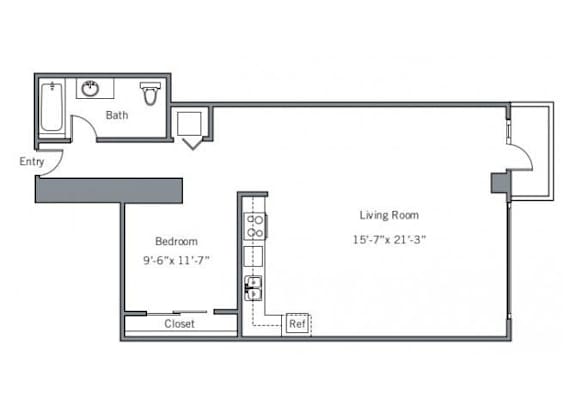 A floor plan of a small apartment with a bedroom, living room, and bathroom.