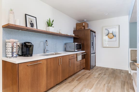 kitchen with Refrigerator and  wooden cabinets and a sink