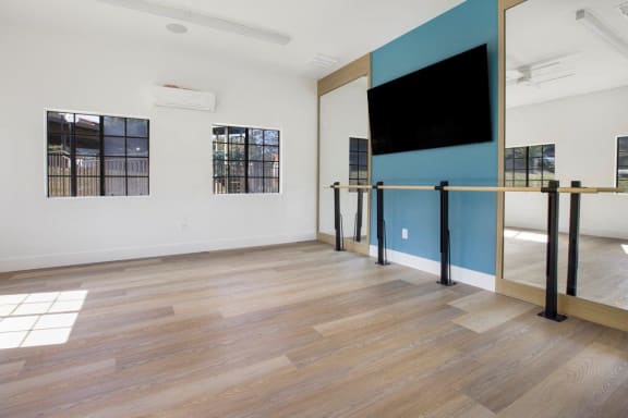 Large room with a tv on the wall and wood floors at Bella Terra, Vista, CA, 92081
