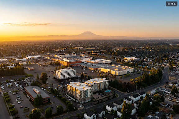 an aerial view of the city at sunset