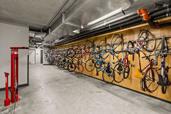 Multiple Bikes hanging on bike rack at Axle, Seattle, 98119