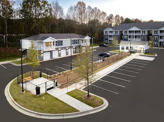 A parking lot with a building in the background.
