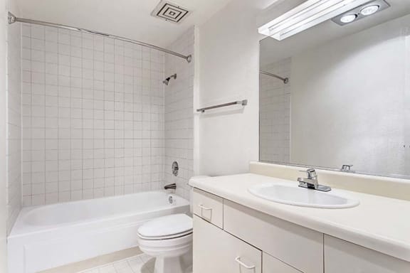 a bathroom with a sink toilet and bathtub