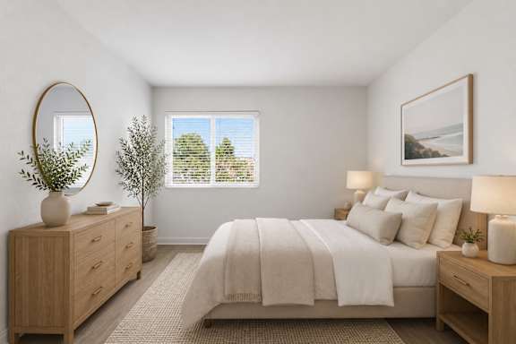 A spacious bedroom with a large bed, a dresser, and a window