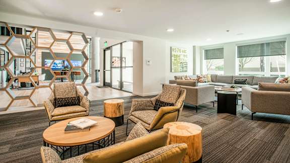 A modern waiting room with a variety of seating options.at Axle, Seattle, WA
