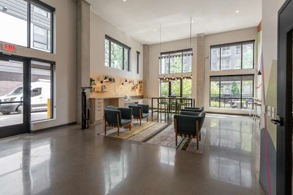 A spacious waiting area with a counter and chairs.