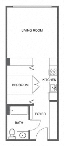 a small room with a desk and a sink