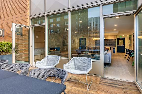 A patio with chairs and a table is shown.
