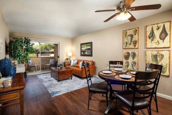 Living room with a dining room table and a ceiling fan at Ascend2300, Carlsbad, CA