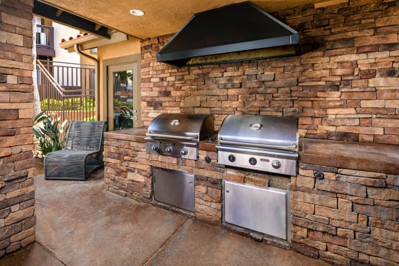 Large outdoor kitchen with two bbqs on a patio at Bella Terra, Vista