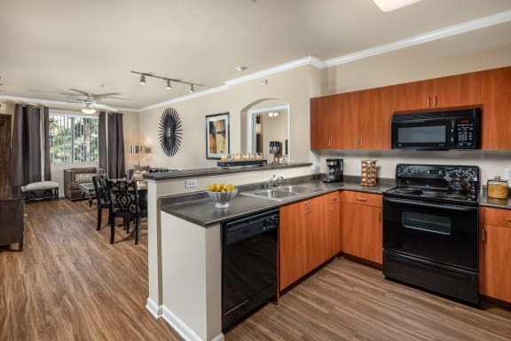 Warm cherry cabinetry with satin nickel hardware  at Ridgestone, Lake Elsinore, 92532