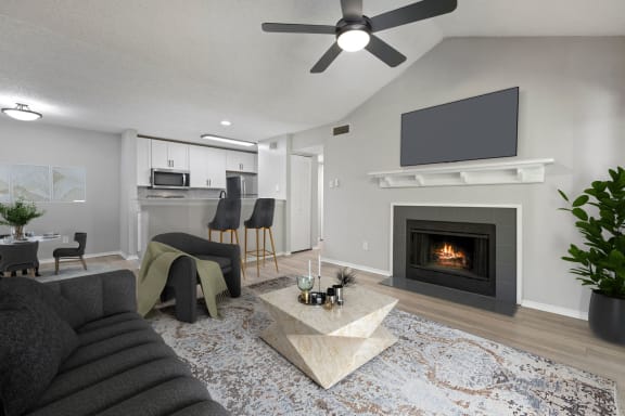 a living room with a fireplace and a tv