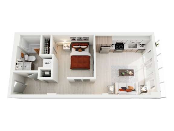 A white model of a small apartment with a bed, desk, and a small kitchenette.