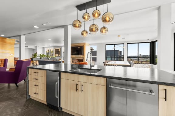 a kitchen with an island and a sink at Ion Town Center, Shoreline, WA 98133