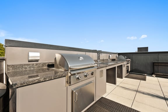 a kitchen with stainless steel appliances and granite counter tops at Ion Town Center, Washington